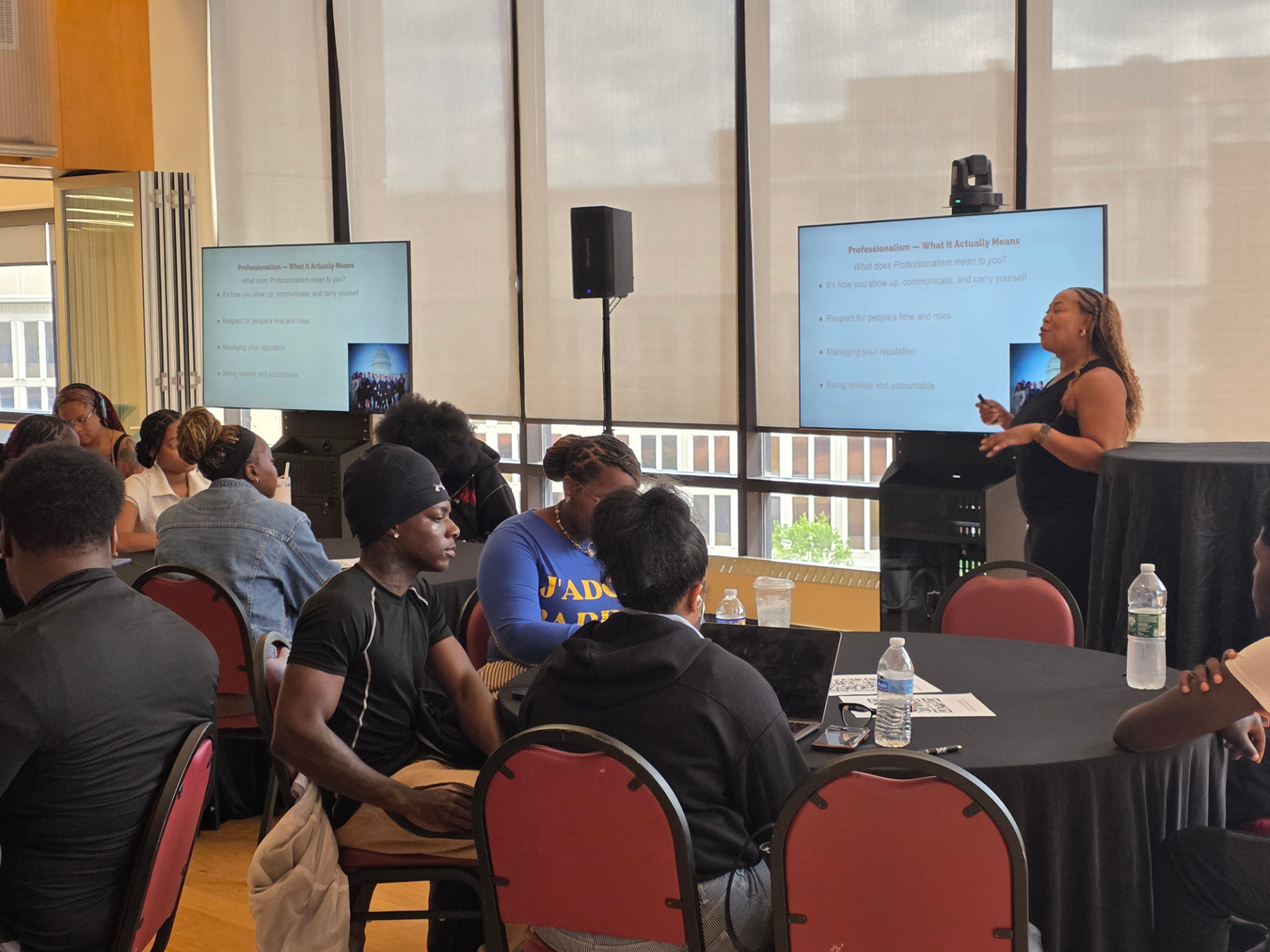 Jasmine K. Hicks leading a professionalism workshop for young adults