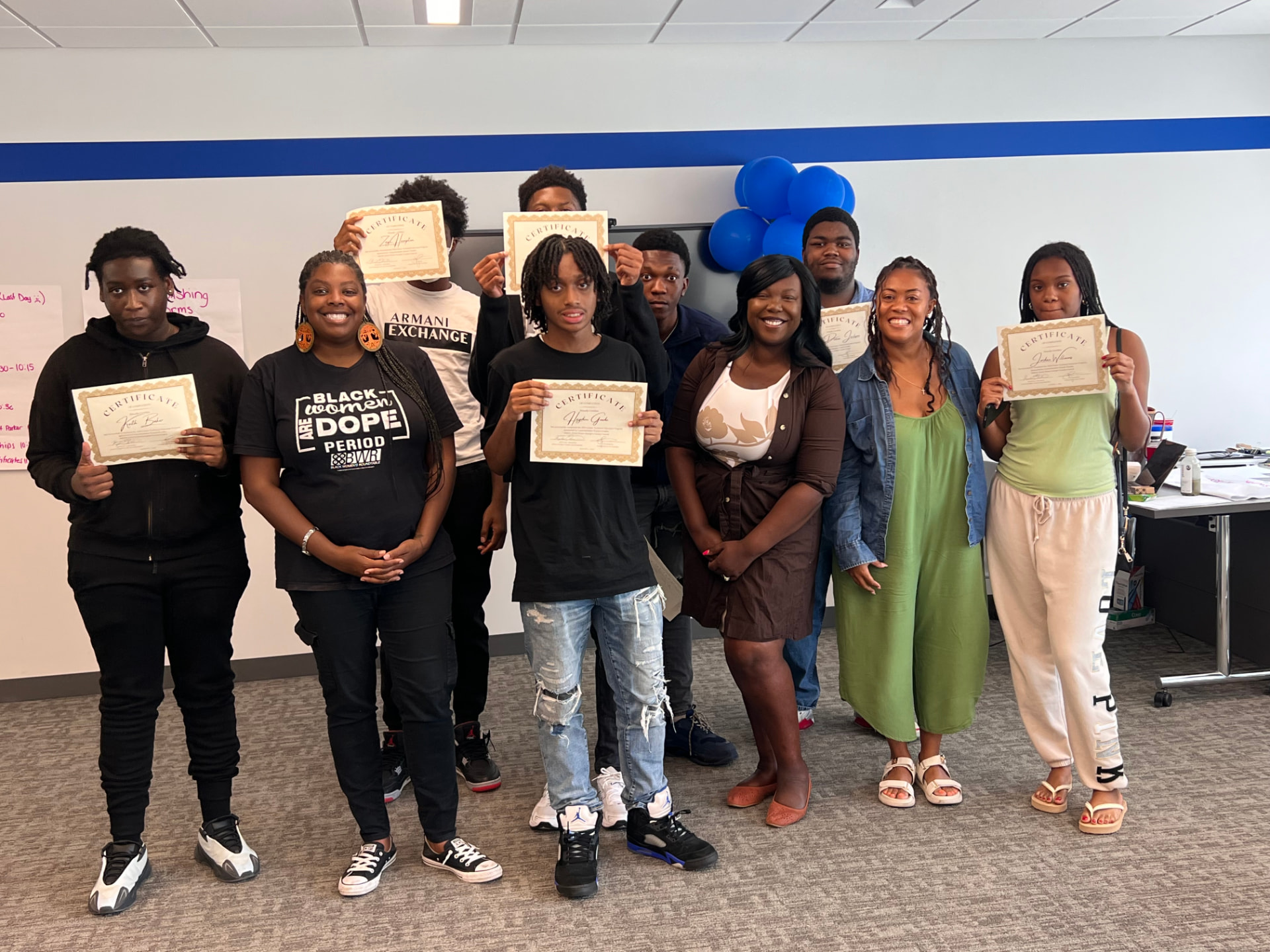 Jasmine K. Hicks with youth leaders at a certificate ceremony